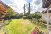 Blick in den Garten - In gepflegter Lage: „Vermieteter Atrium-Bungalow mit Garage in Oststeinbek“