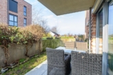 Einladende Terrasse - Optimal angebunden in Hamburg-Lohbrügge: „Moderne 2‑Zimmer-Erdgeschosswohnung mit KfW-55-Standard“